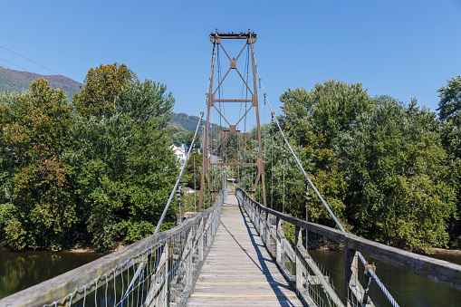 The Buchanan Swinging Bridge over the James River in Virginia was originally built in 1851 and replaced several times over the years.  The Bridge is 366 feet long, 57.5 feet tall and the only one of its type to cross the James River. 