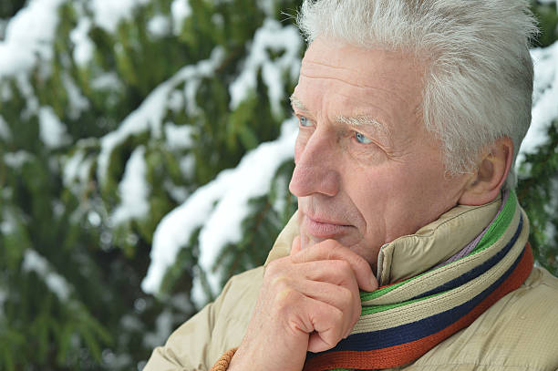 istock Senior man standing  in winter 506909468