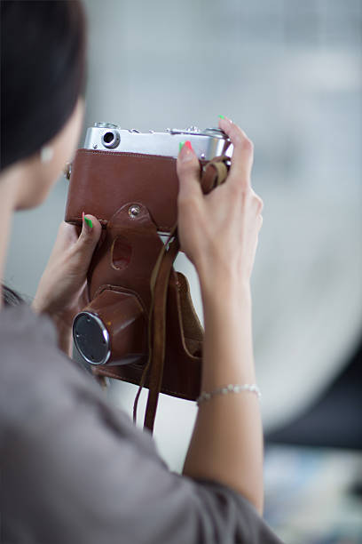 istock Woman is a proffessional photographer with camera 506909621