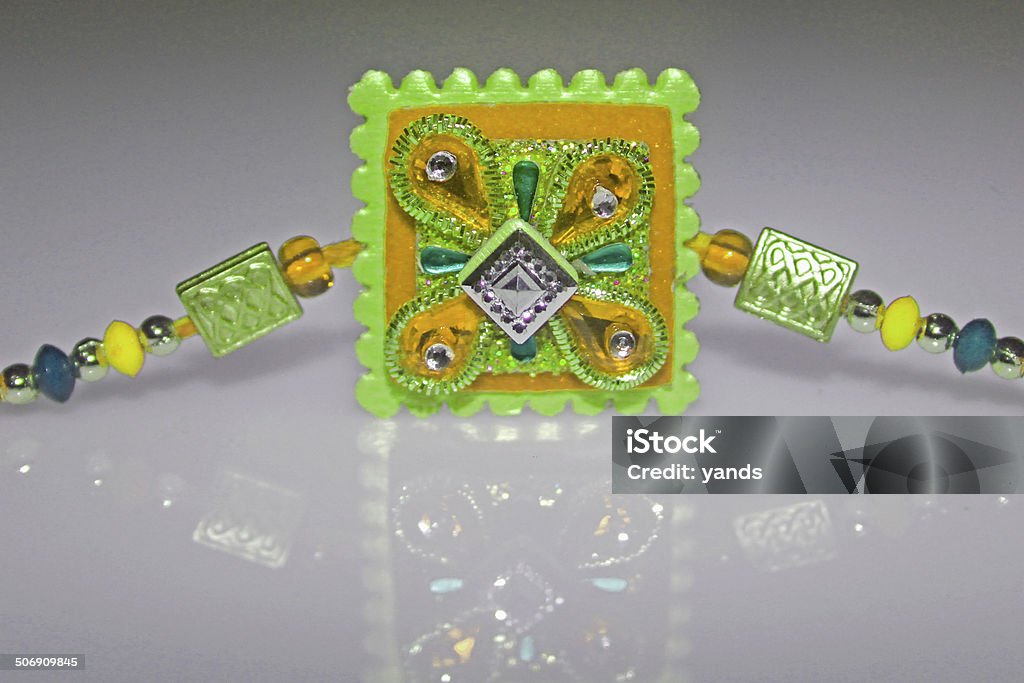 RAKHI, traditional wrist band represents bonding between Sister-Brother Rakhi for Raksha Bhandhan, it is a traditional indian festival in which a sister ties rakhi on the hand of his brother. Asia Stock Photo