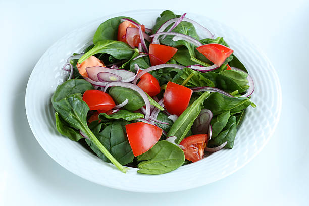 istock Tomato Onion and Baby Spinach Salad 506909886