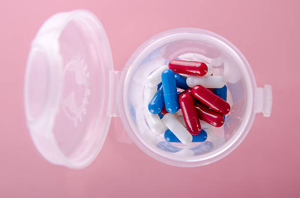 istock Bottle full of colored pills 506911274
