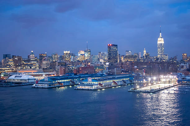 New York City, USA - March 9, 2005 : A view of the panorama of Midtown Manhattan coast with Chelsea piers sports and entertainment complexat at sunset in New York City, USA.