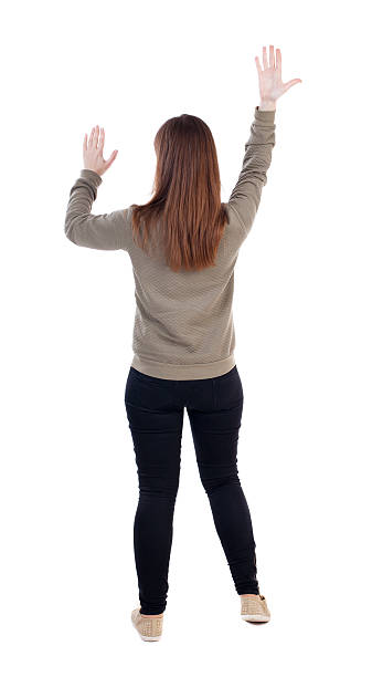 istock back view of dancing young beautiful  woman. 506911906