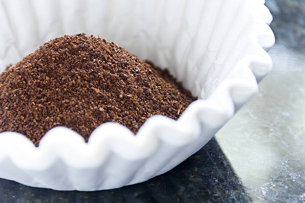 Coffee Grounds Filter Fresh coffee grounds ready to be brewed for morning jolt of caffeine arabica coffee drink photos stock pictures, royalty-free photos & images