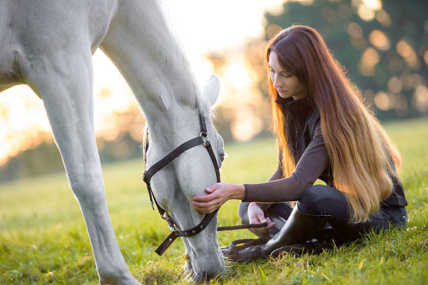 istock Young woman with horse 506912532