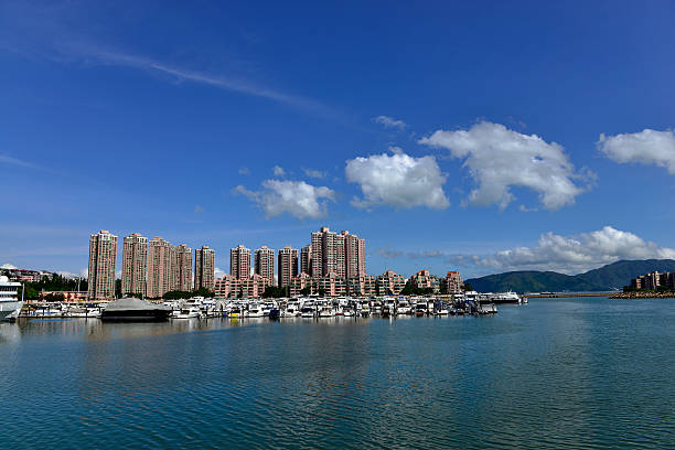 Golden coast house and yacht park at the pier stock photo