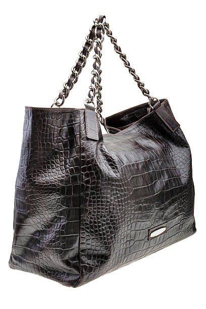 istock Black leather womens bag isolated on white background. 506913174