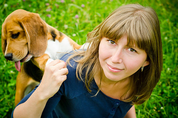 istock woman with beagle 506914001