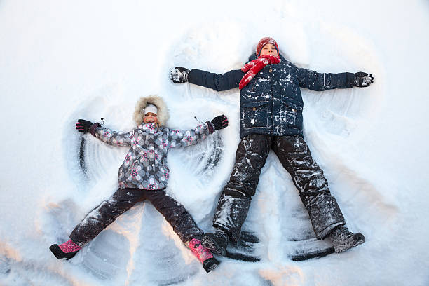 istock Children playing in a snow enjoying winter 506914852