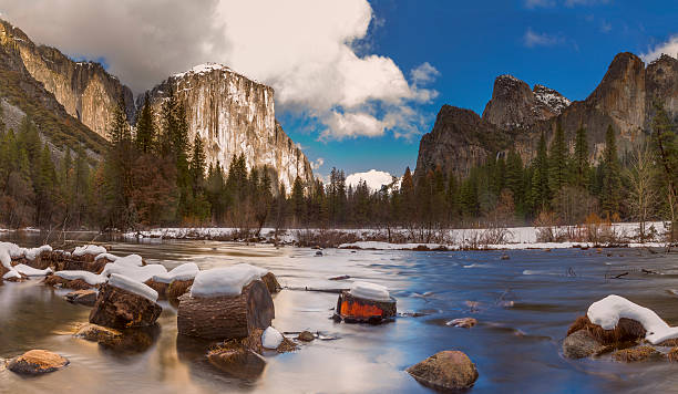 Yosemite National Park in Winter , California El Capitan Half Dome and Merced River , Yosemite National Park , California in the Sierra Nevada mountains. Snow covered the ground. mariposa county stock pictures, royalty-free photos & images
