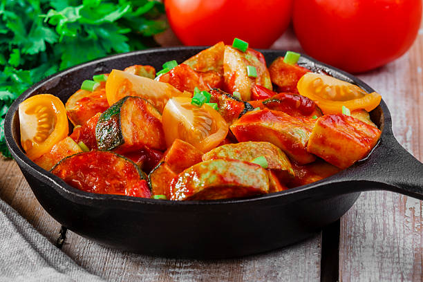istock roasted squash and zucchini in tomato sauce 506915521