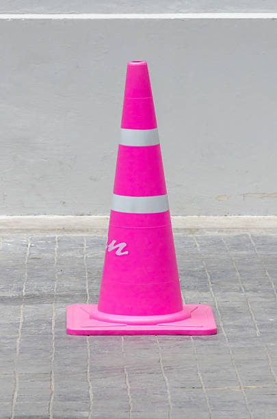 istock light pink Traffic cone in the road 506915779