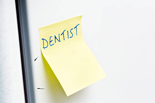 istock 'Dentist' reads reminder note on fridge door 506915816