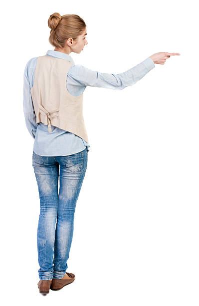 istock Back view of  pointing woman. 506915908