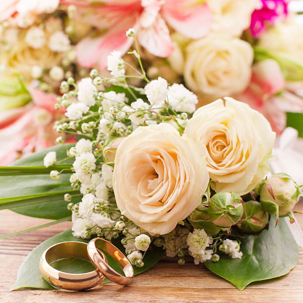 istock White delicate flowers on wooden surface. Wedding bouquet, background. 506916021