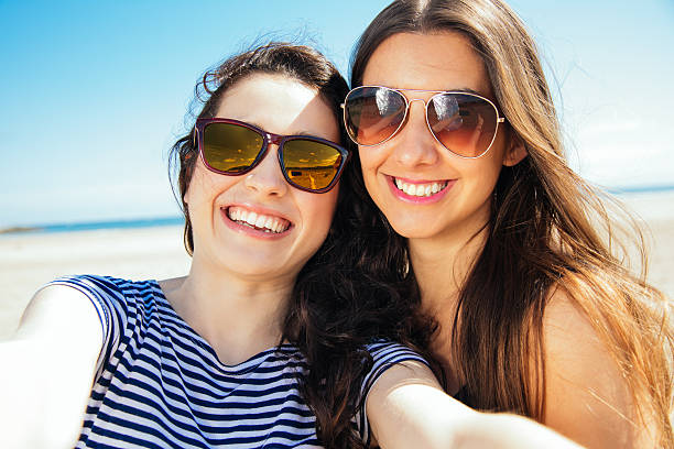 istock Happy selfie friends on the beach 506916644
