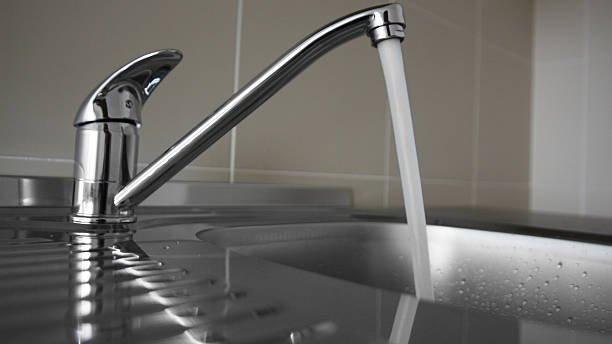 istock Kitchen faucet with water 506916850
