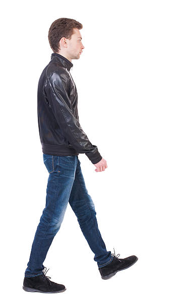 istock Back view of going  handsome man in jacket. 506917026