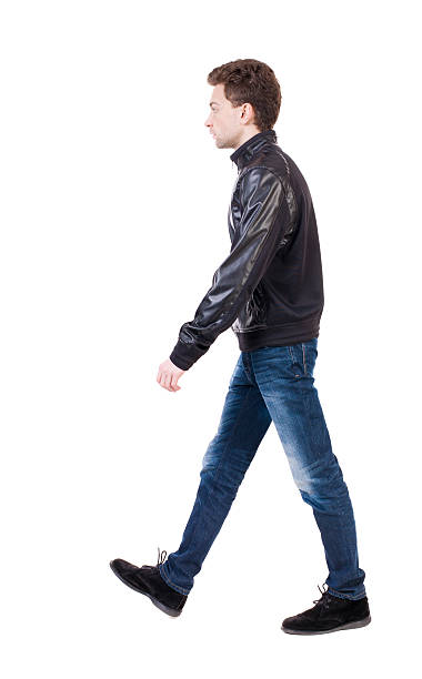 istock Back view of going  handsome man in jacket. 506917064