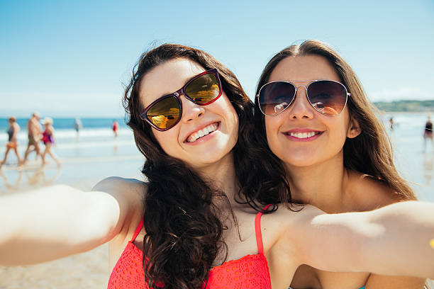 istock Happy selfie friends on the beach 506917074