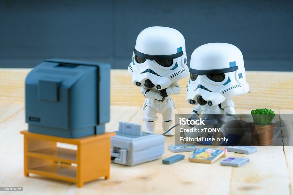 Stormtrooper figure playing the gameboy BANGKOK Thailand - December 18, 2015 : Stormtroopers figure model playing the game, The stormtroopers are soldiers in the Star Wars The Force Awakens Star Wars Stock Photo