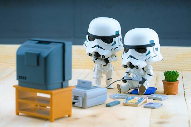 Stormtrooper figure playing the gameboy BANGKOK Thailand - December 18, 2015 : Stormtroopers figure model playing the game, The stormtroopers are soldiers in the Star Wars The Force Awakens star wars stock pictures, royalty-free photos & images