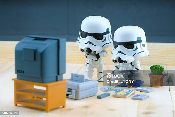 Stormtrooper Figure Playing The Gameboy Stock Photo - Download Image Now - Star Wars, Video Game, Figurine