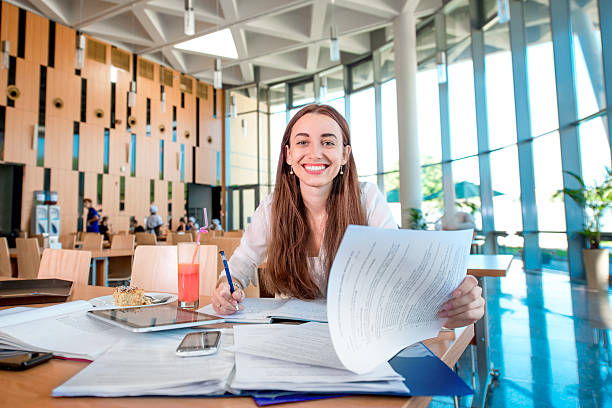 istock Girl studying in the University canteen with Fresh and cake 506918059