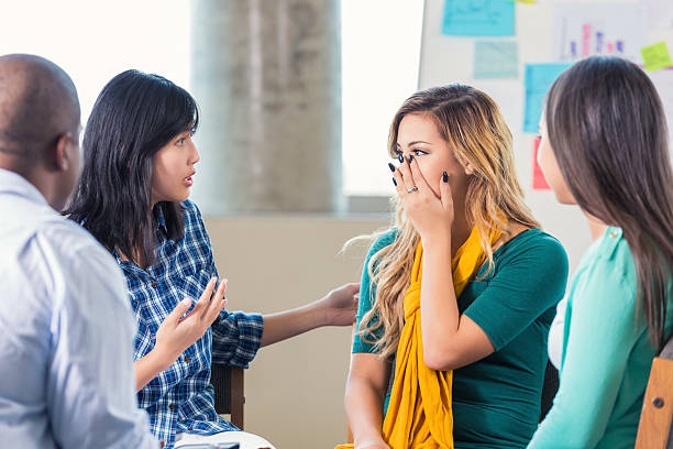 istock Hispanic teenager is emotional in support group 506918216