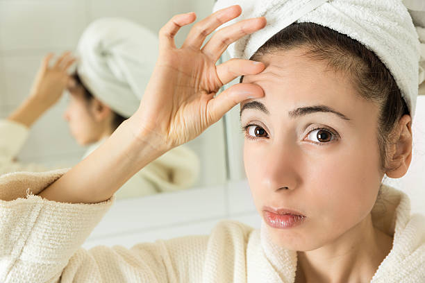 istock Woman showing her forehead wrinkles 506918308