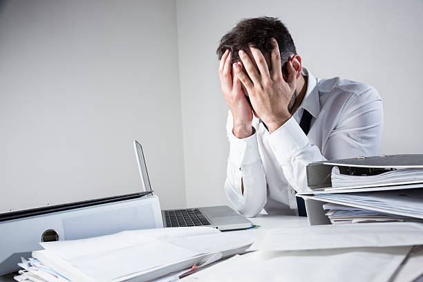 istock office despair messy desk business man 506918705