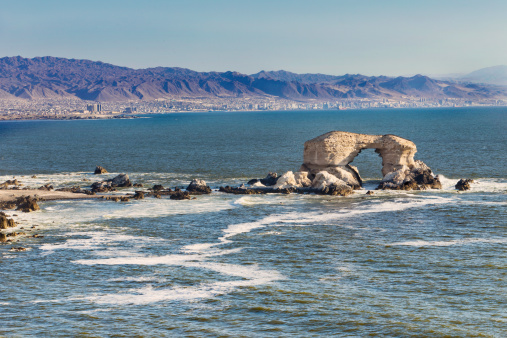 Natural arch, icon of Antofagasta city in north of Chile, near of atacama desert.