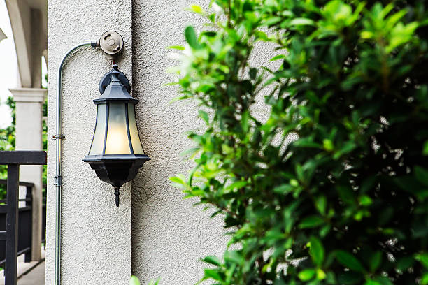 istock Old iron street lantern on a wall 506920883