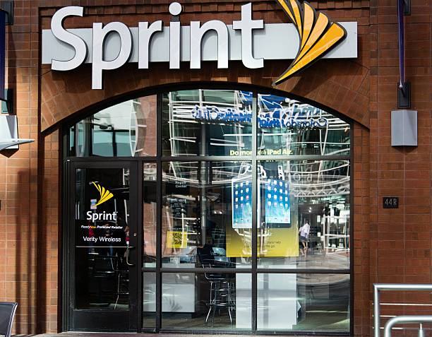 Sprint Denver, USA - May 16, 2014: People reflected in the windows of a Sprint store in downtown Denver. Sprint Nextel is a telecommunications provider with 2011 revenues of over $33 Billion. sprint nextel stock pictures, royalty-free photos & images
