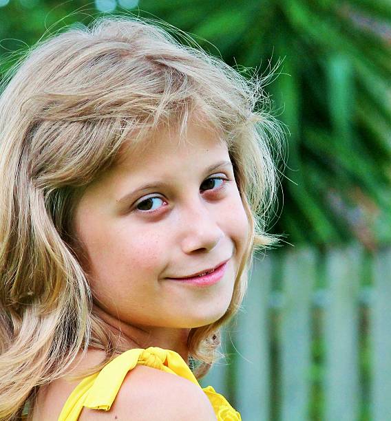 istock Little Girl Looking Over Shoulder 506922383