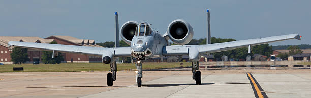 The A-10 Thunderbolt II at Langley AFB Hampton, USA - May 15, 2011: The Fairchild Republic A-10 Thunderbolt II performing air show routine at the Langley Air Force Base located in Hampton, VA during The 2011 Air Power Over Hampton Roads Open House and Air Show on May 15, 2014. The A-10 more commonly known as Warthog or Hog is a twin-engine jet aircraft  designed for close air support of ground forces. a10 warthog stock pictures, royalty-free photos & images