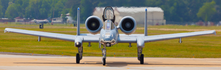 Hampton, USA - May 14, 2011: The Fairchild Republic A-10 Thunderbolt II performing displayed at the Langley Air Force Base located in Hampton, VA during The 2011 Air Power Over Hampton Roads Open House and Air Show on May 14, 2014. The A-10 more commonly known as Warthog or Hog is a twin-engine jet aircraft  designed for close air support of ground forces.