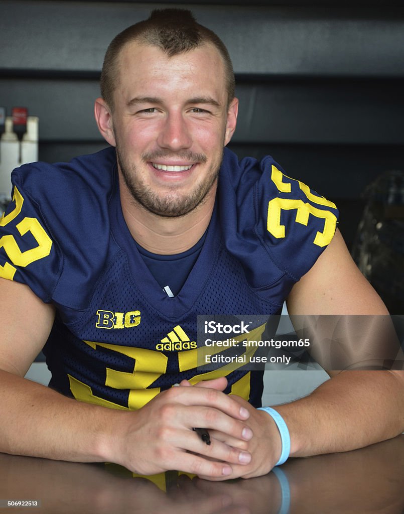 UM football player 32 Shaun Austin Ann Arbor, MI - August 10, 2014: University of Michigan football player Shaun Austin pauses between autographs at Michigan Football Youth Day on August 10, 2014 in Ann Arbor, MI. Ann Arbor Stock Photo