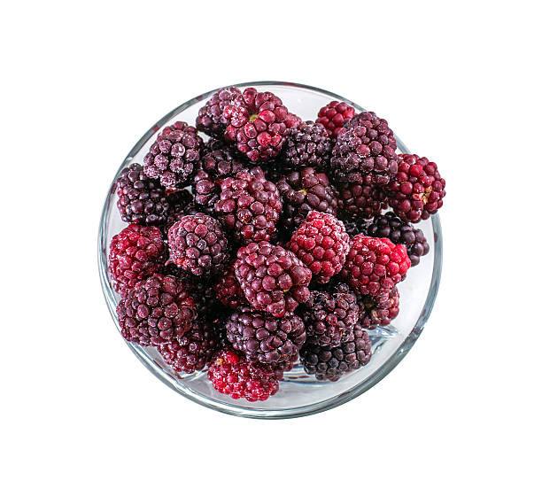 istock Frozen domestic red blackberries - isolated on white background 506922662