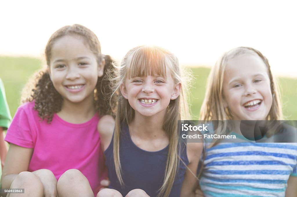 Kids outdoors Group of kids playing outdoors 8-9 Years Stock Photo