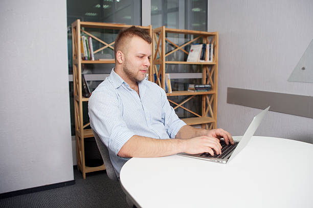 istock Hipster businessman working at his desk office 506923386