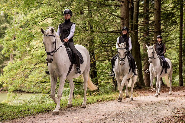 istock Women riding horses 506924534