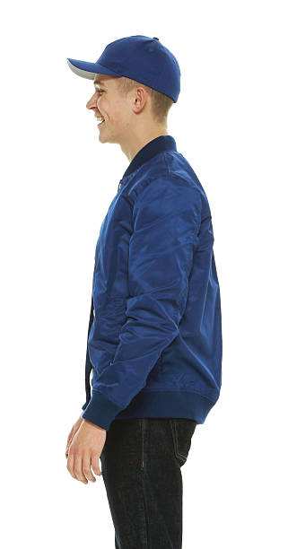 istock Cheerful male standing and looking away 506924822