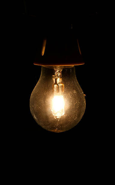 istock Halogen Savings Light Bulb in the Dark 506930451