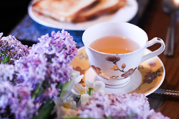 masala chai tea of india with bread, butter and lilac flower