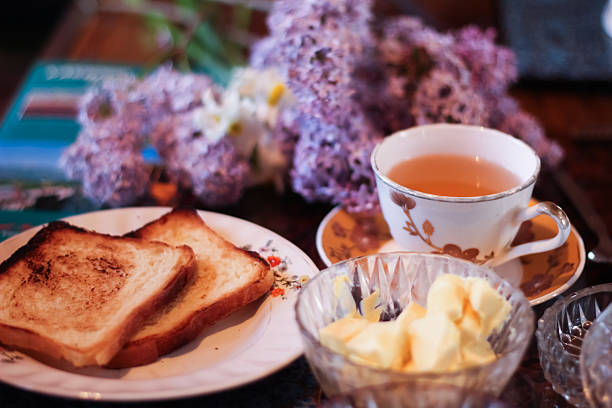 masala chai tea of india with bread, butter and lilac flower