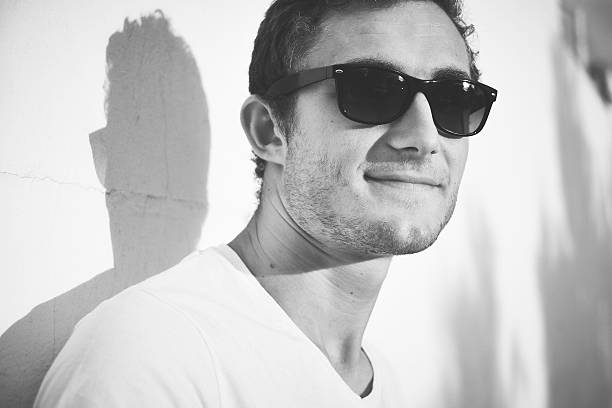 istock young man with sun glasses 506931319