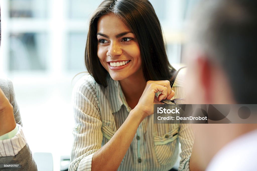 smiling businesswoman at office Portrait of a young smiling businesswoman at office Adult Stock Photo