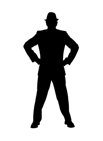 Silhouette of a man in a suit and hat as an authority 